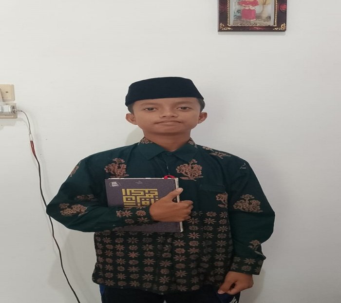 Siswa MTsN 5 Batang Hari, Muflihun Kelas VIII A, Menjadi Peserta Tartil Quran pada MTQ ke-54 Tingkat Provinsi Jambi